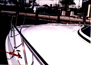 curved foredeck with  low railing boat