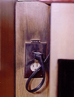 Electrical service outlet burning behind the panel